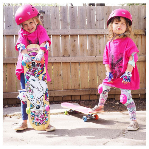 2 young girls with Skateboards. Showing SkateXS Unicorn Skateboard and Colorful Wheels